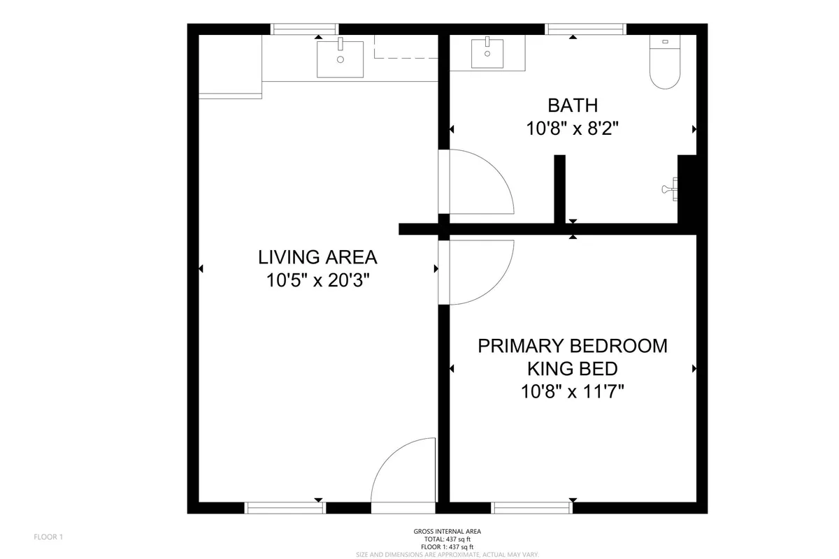 A cozy and intimate interior view that includes both the primary bedroom and a glimpse of the living area and bathroom. The spacious bedroom is complemented by comfortable furnishings, and the ambiance feels restful and welcoming.